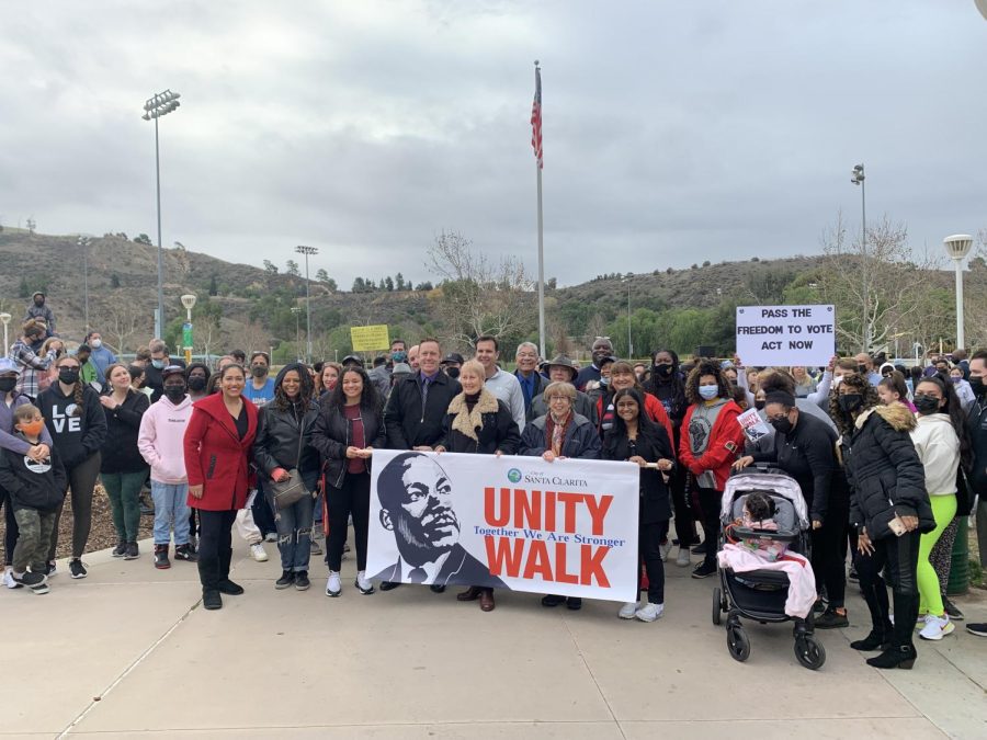 The Mayor, council members, and speakers, and those in attendence pose for a picture at the MLK unity walk.